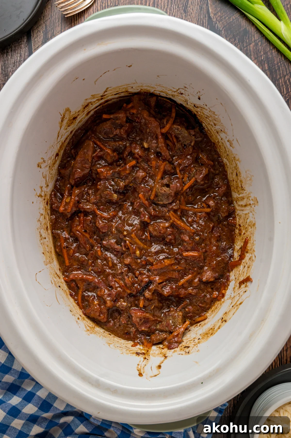 Slow Cooker Mongolian Beef Recipe — Tender Garlic Soy Beef 8 slow cooker mongolian beef in a crockpot after cooking.