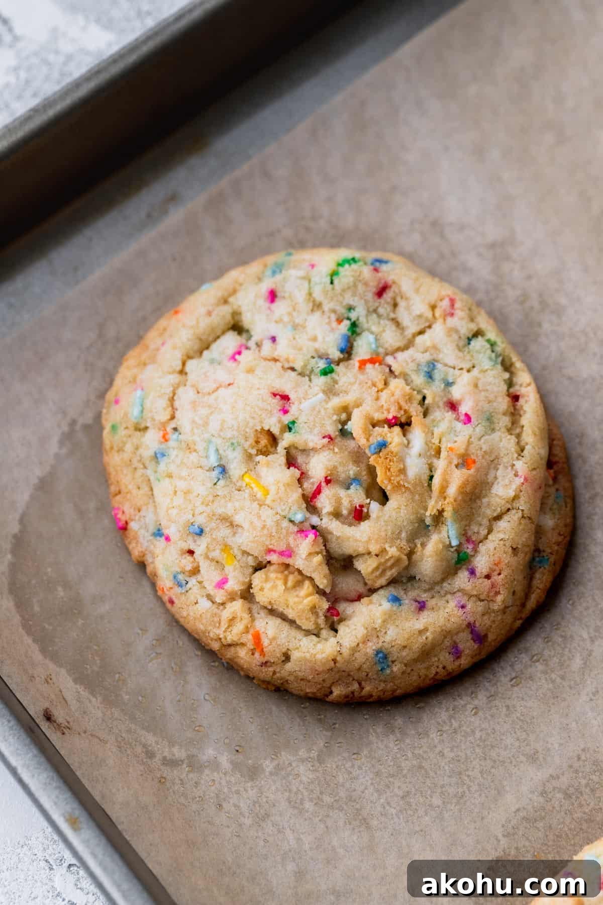 Baked cookie on cookie sheet.