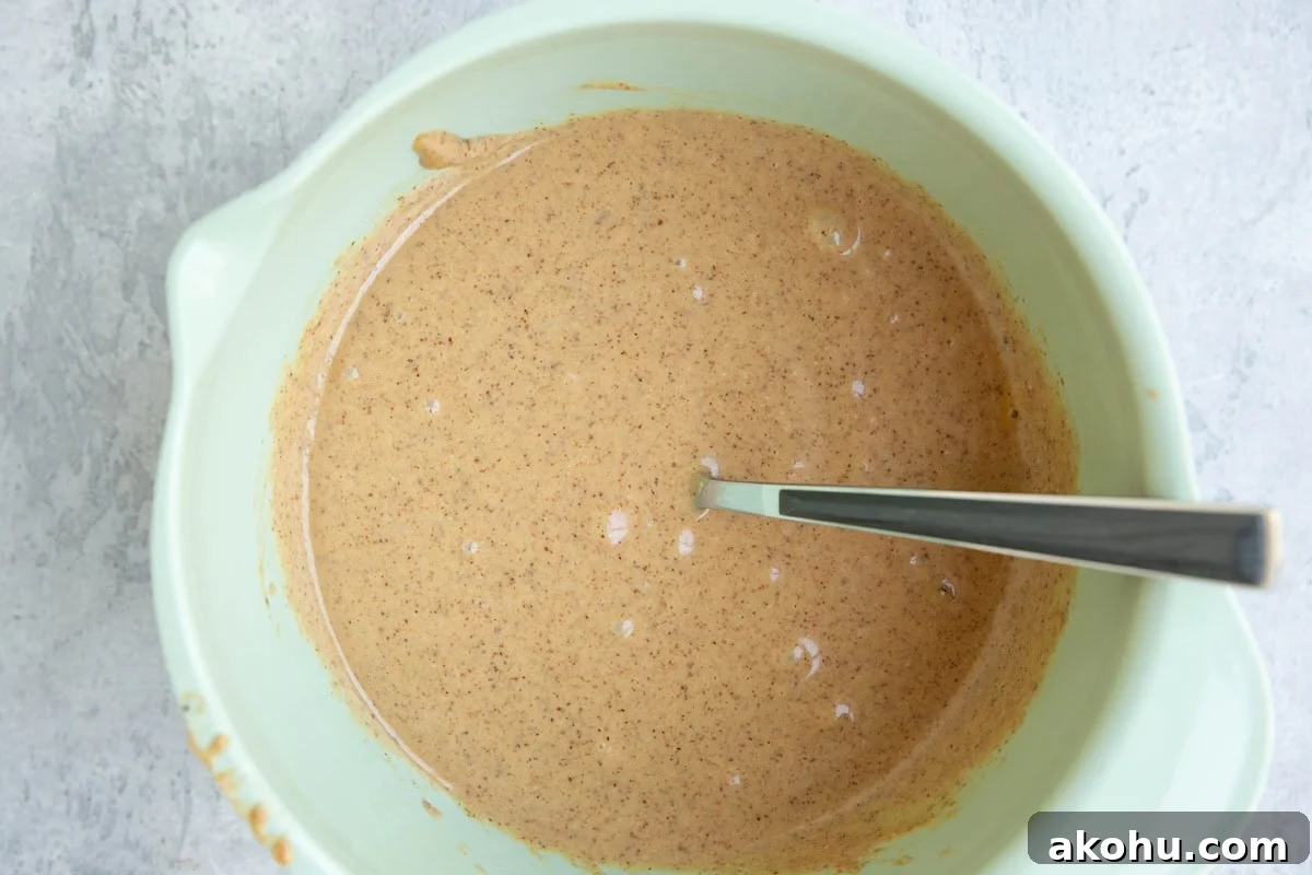 Mixing bowl full of wet ingredients.