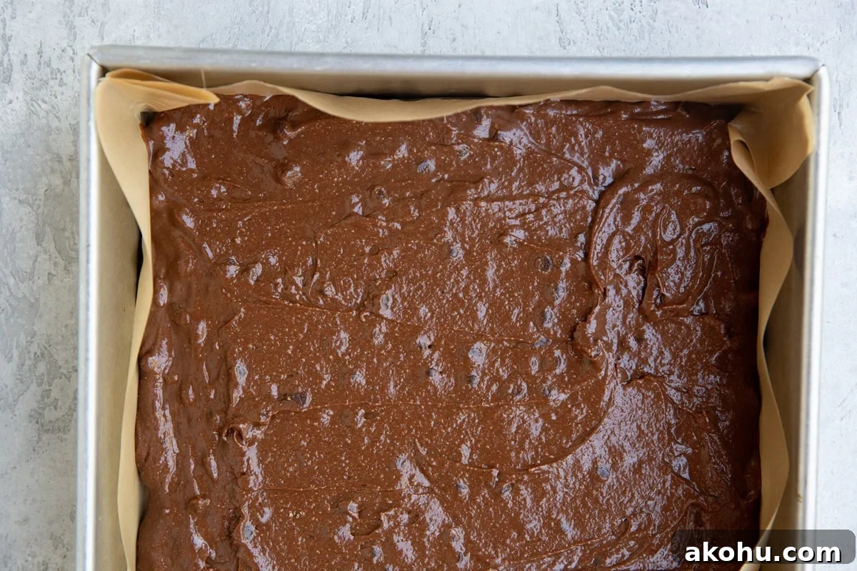 Baking dish full of brownie batter, ready to go into the oven.