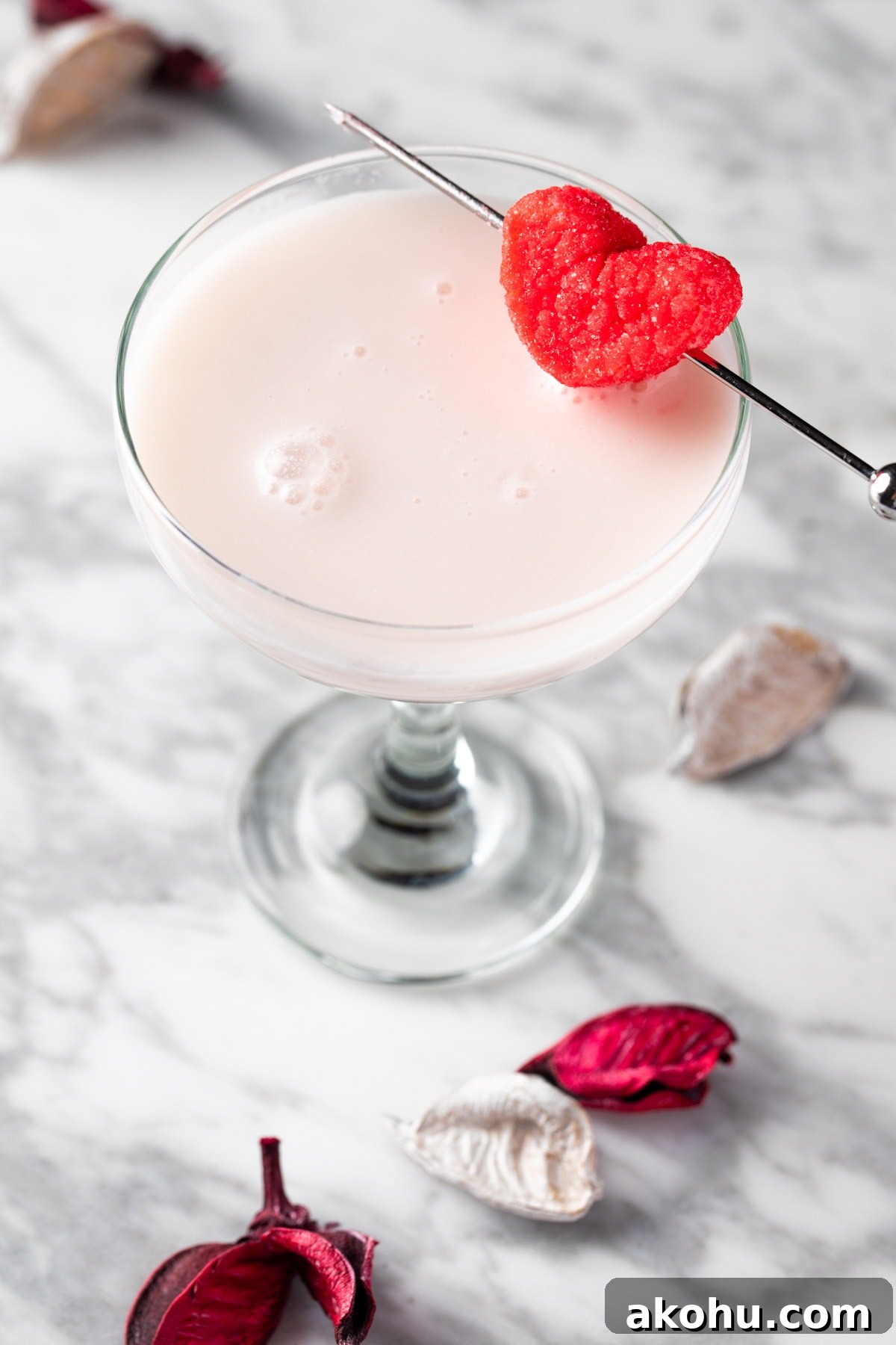 A white chocolate raspberry martini garnished with a heart marshmallow.
