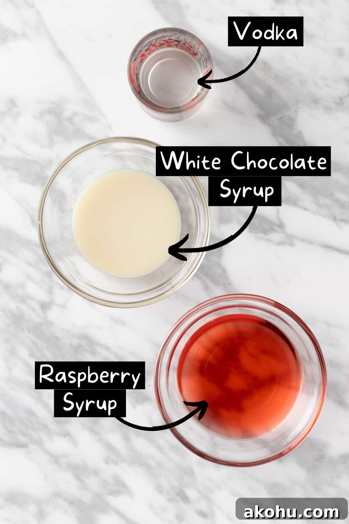 The ingredients needed to make a white chocolate raspberry martini.