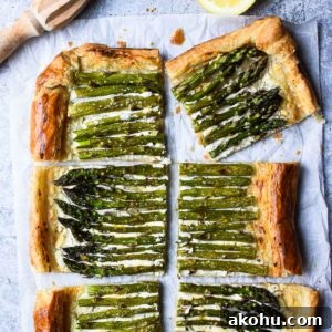 Asparagus and Whipped Goat Cheese Puff Pastry Tart 10 Overhead of asparagus and whipped goat cheese puff pastry tart cut into six pieces with a lemon to the side