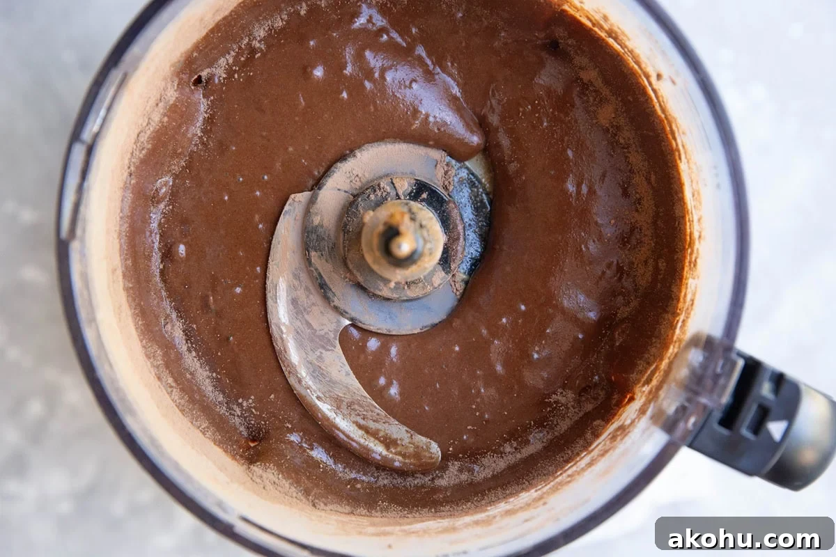 Chocolate cake batter in a food processor, ready to bake.