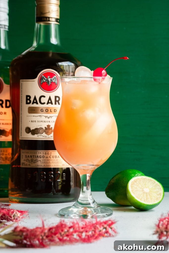 Refreshing Bacardi Rum Punch Recipe for Parties 2 rum punch with bacardi bottles behind it