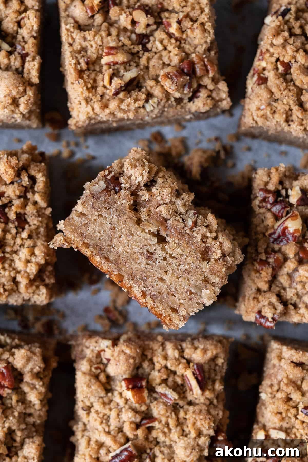 Close up of a square of vegan banana crumb cake on its side.