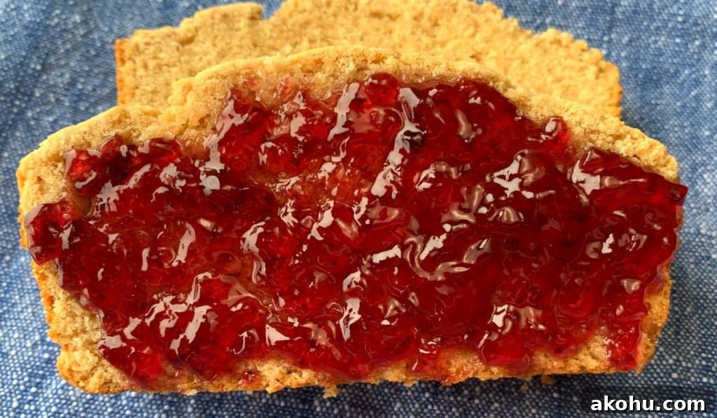 Grape Jelly on slice of Peanut Butter Bread on blue napkin