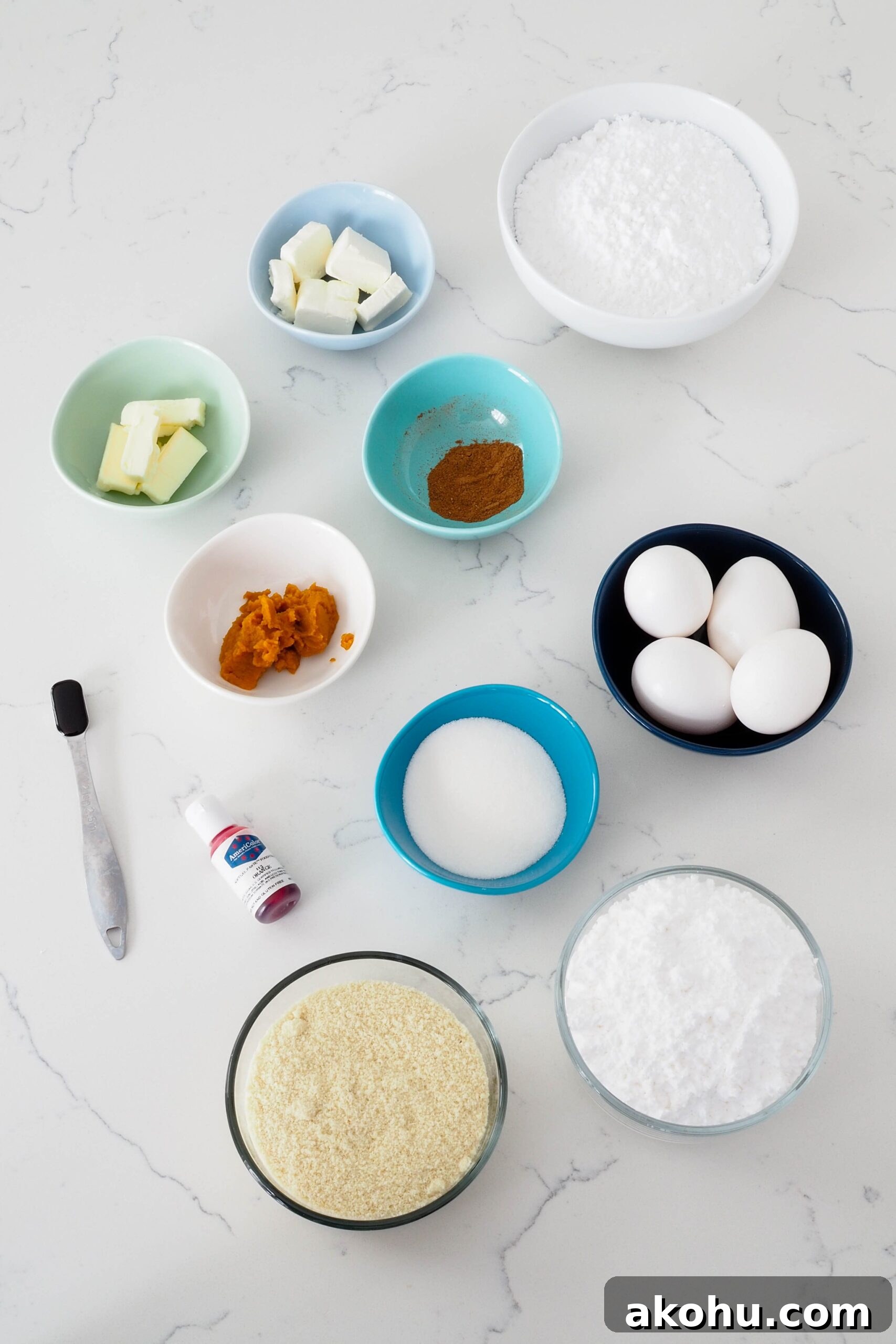 Ingredients for the pumpkin spice macarons are laid out on a counter.