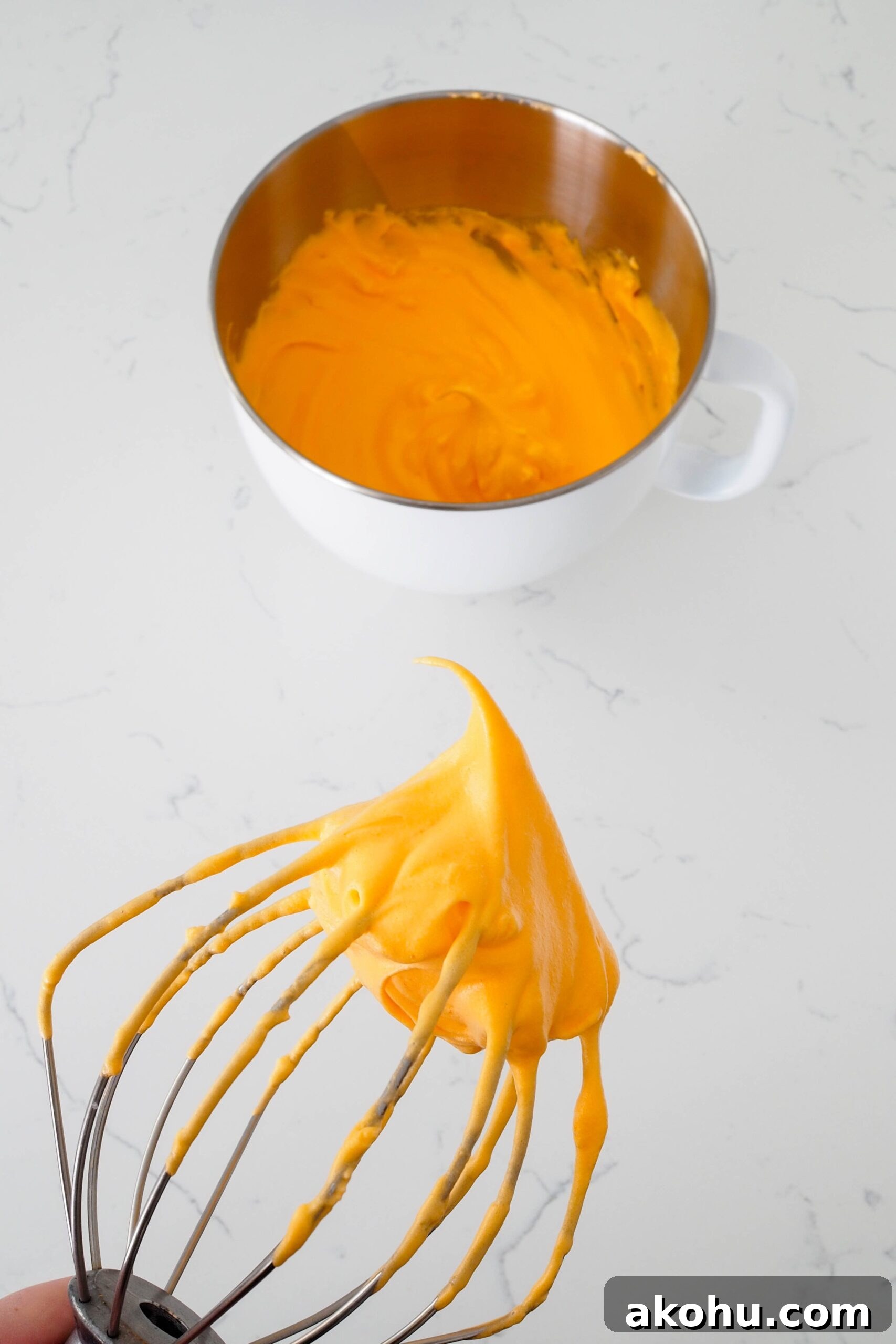 A clump of orange meringue with a stiff peak.