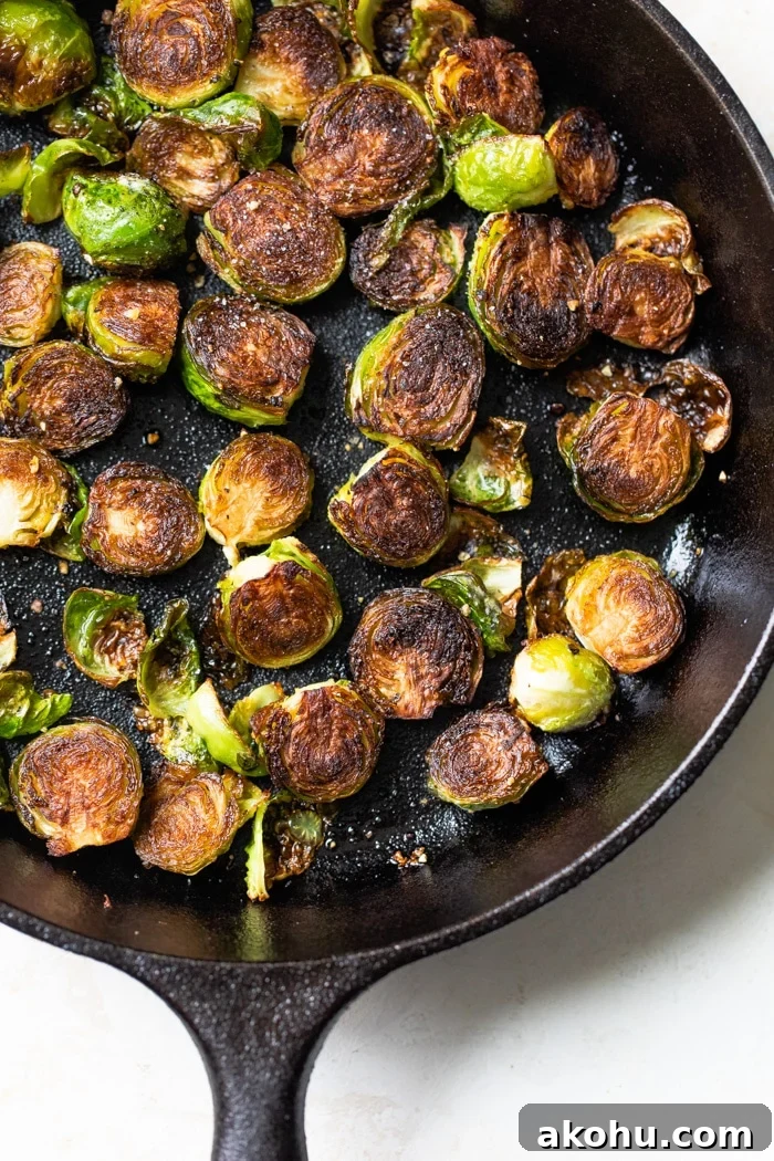Crispy Pan-Fried Brussels Sprouts Recipe with Garlic 2 fried brussels sprouts in a skillet
