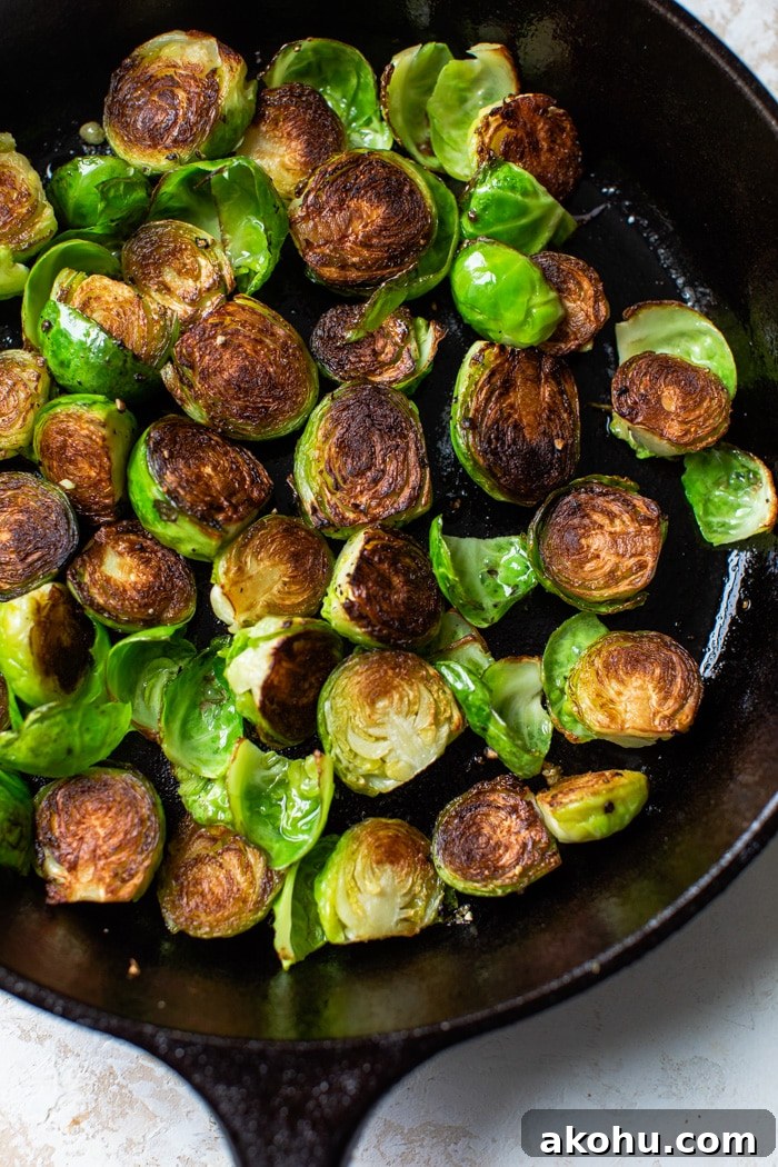 Crispy Pan-Fried Brussels Sprouts Recipe with Garlic 4 brussels sprouts fried in a skillet