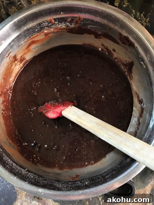 brownie batter all mixed up in bowl with spatula