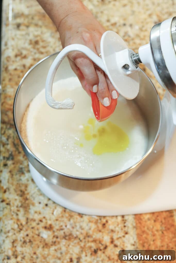 adding wet ingredients to the stand mixer