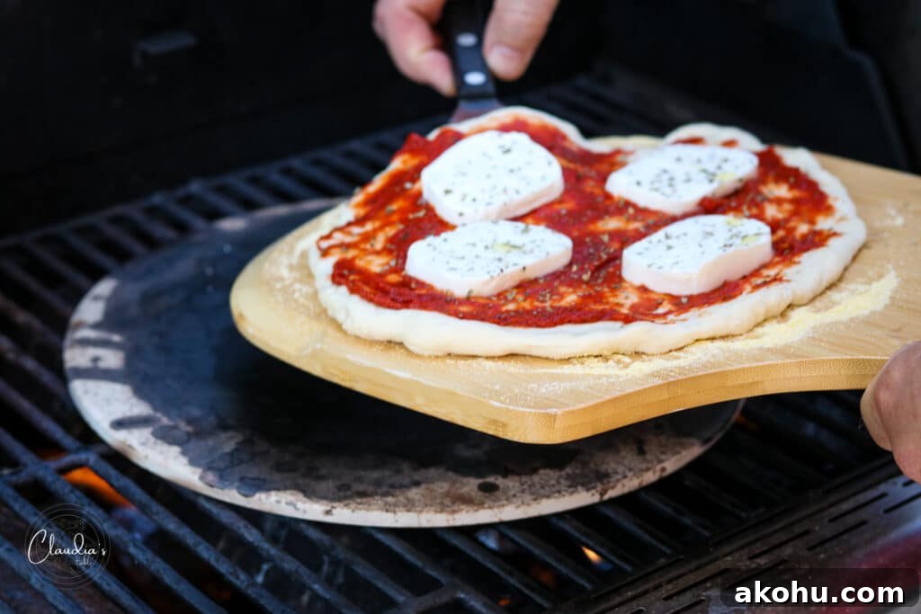 placing pizza onto pizza stone
