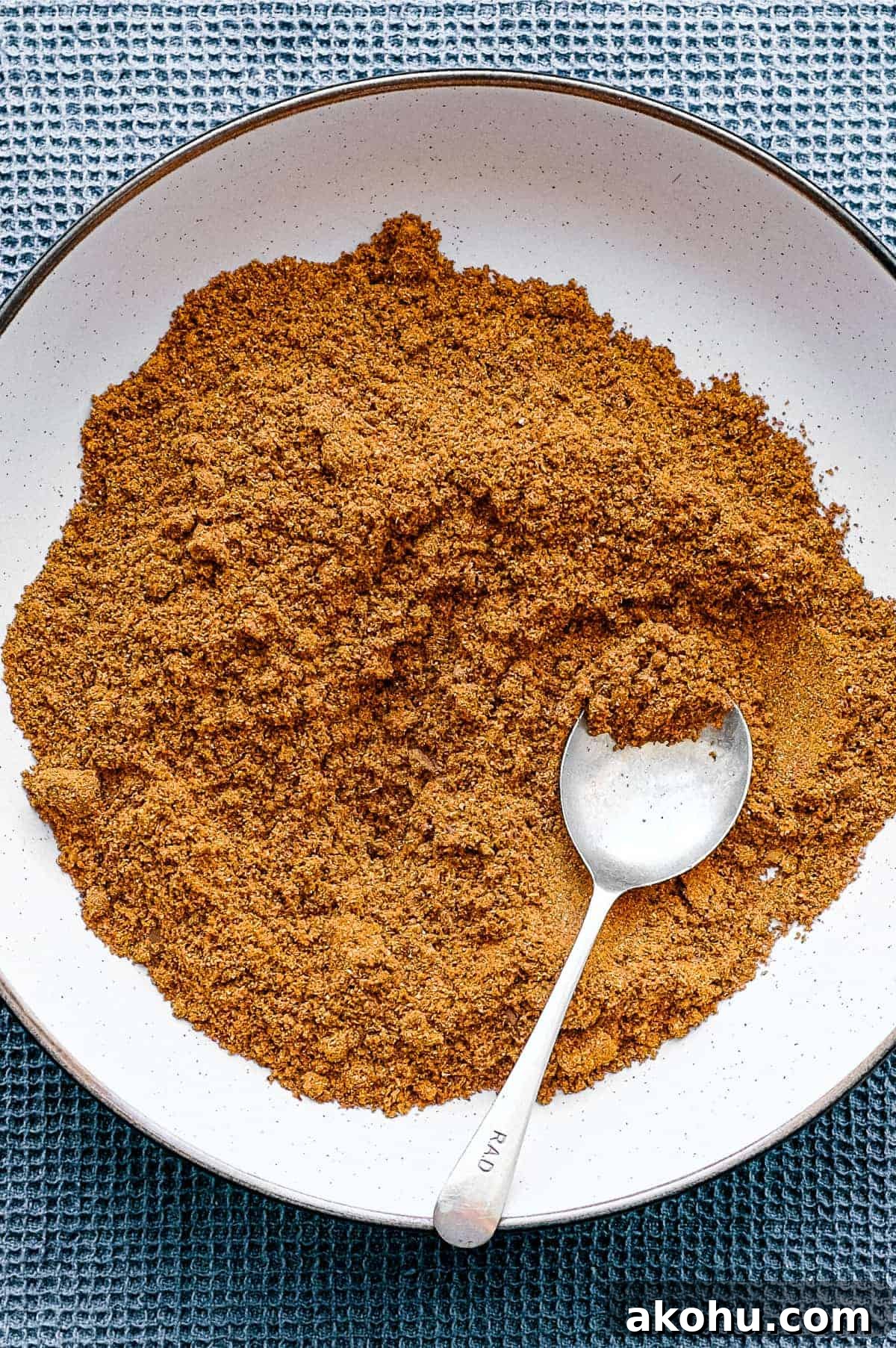 Sri Lankan Curry Powder Recipe | cookeatworld.com A bowl of Sri Lankan curry powder with a small spoon