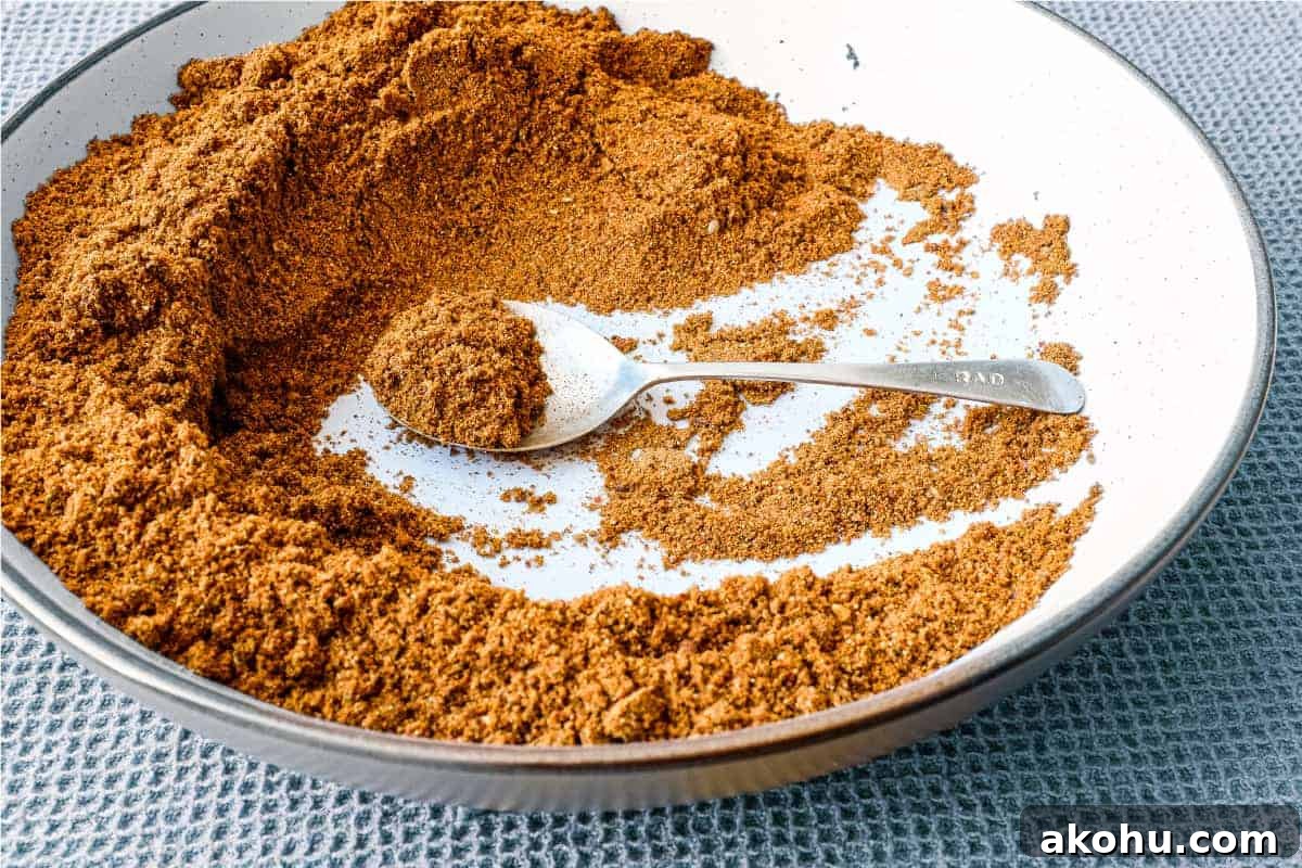 How to Make Authentic Sri Lankan Curry Powder 2 A small bowl of Sri Lankan curry powder with a spoon