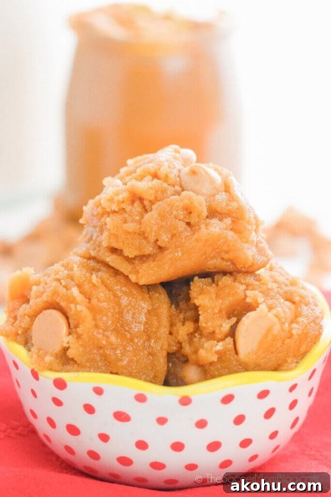 Edible Peanut Butter Cookie Dough Recipe 5 bowl of edible peanut butter cookie dough with jar of peanut butter in background