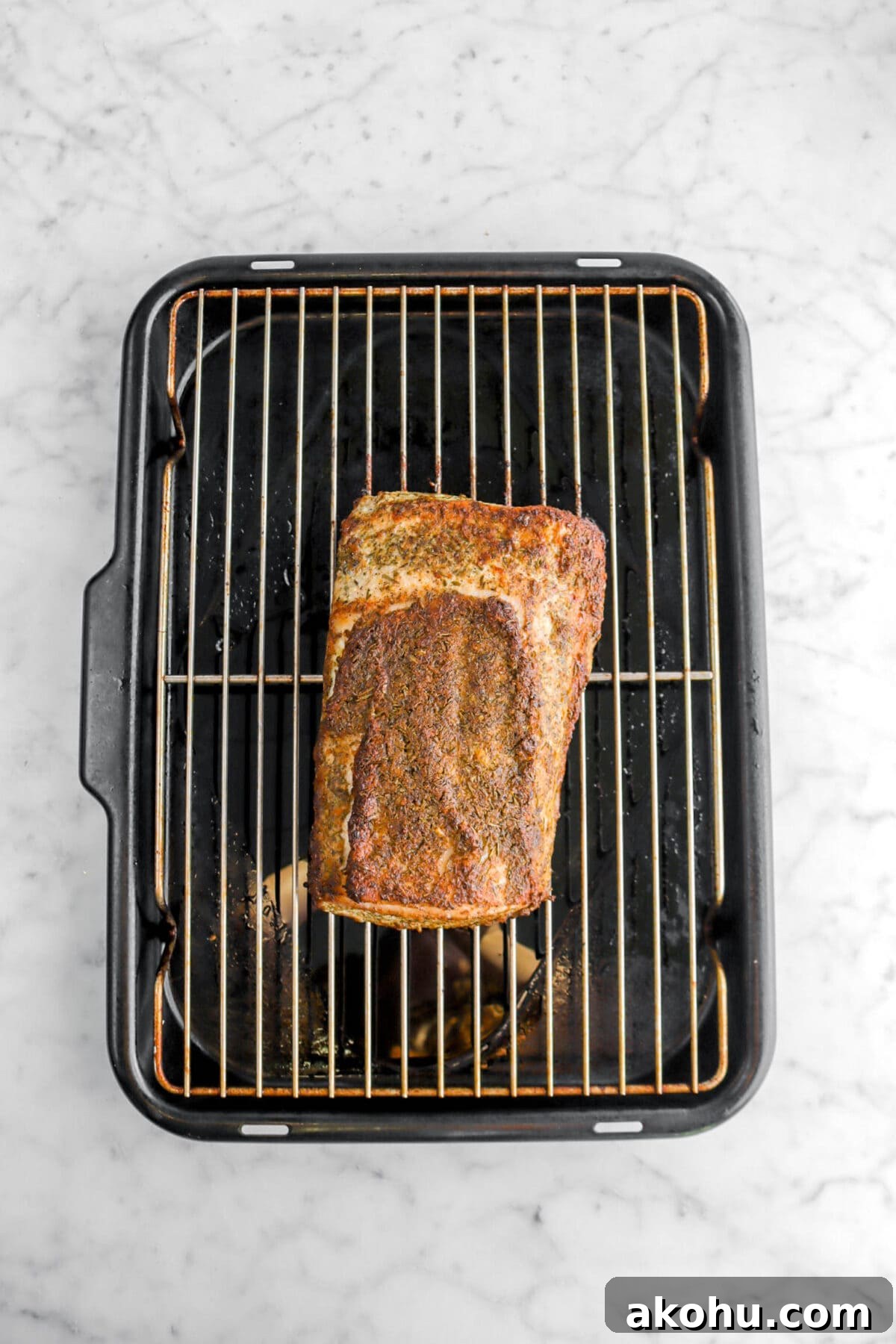 roasted pork loin on roasting pan.