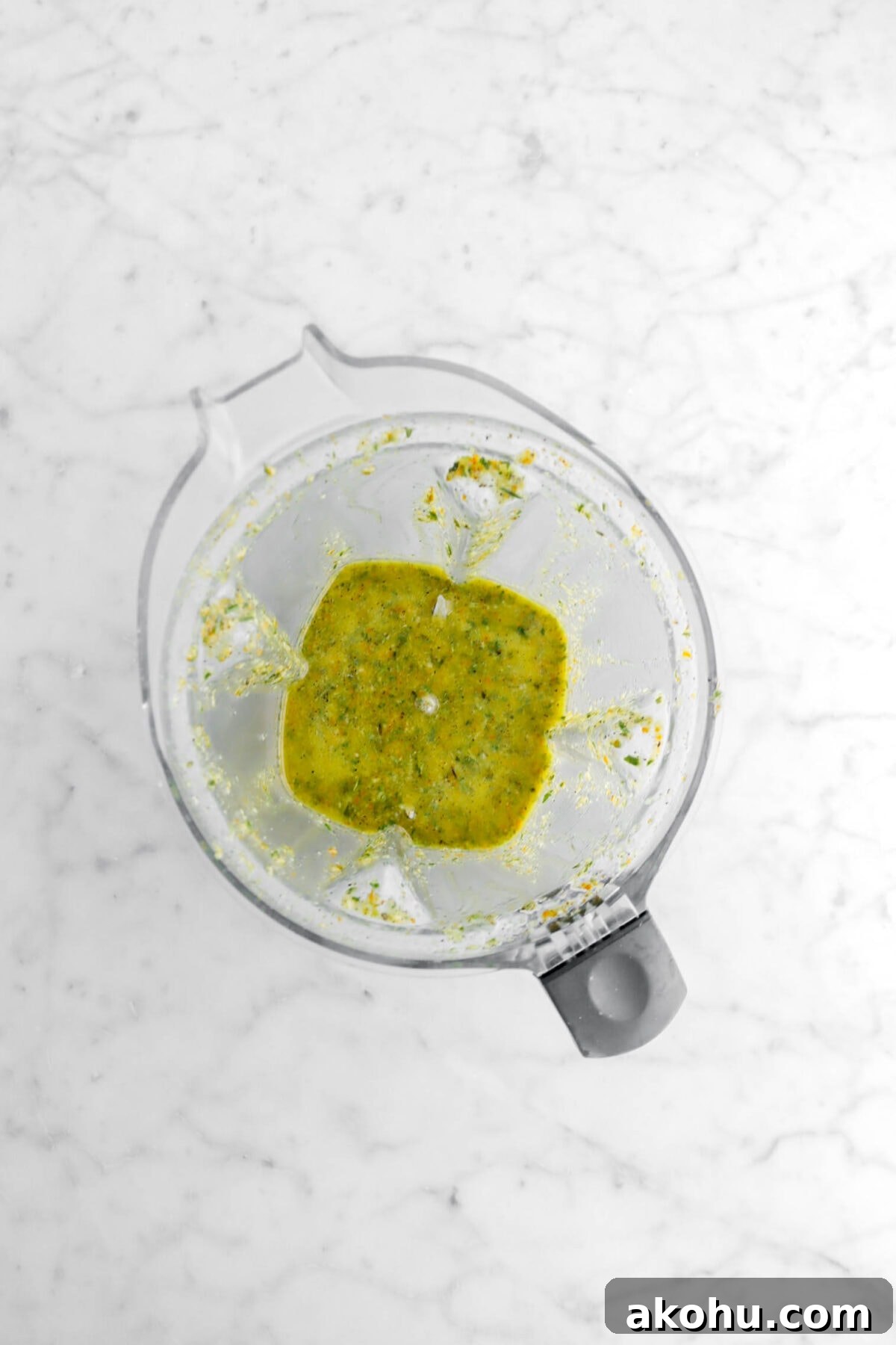 pork marinade in blender on marble surface.