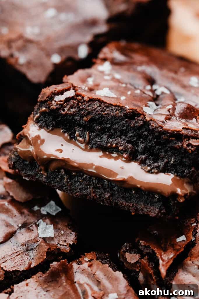 A close-up on a brownie stuffed with luscious nutella.