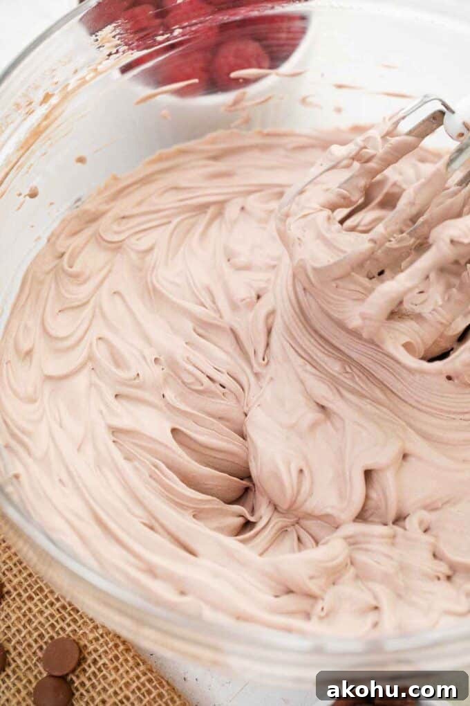 Chocolate Baileys Poke Cake Recipe 12 chocolate Baileys whipped cream in a bowl