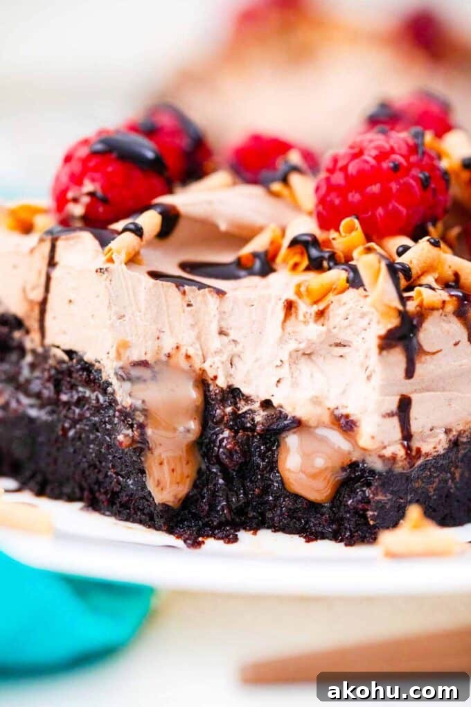 Chocolate Baileys Poke Cake Recipe 14 chocolate sauce oozing from a chocolate baileys poke cake