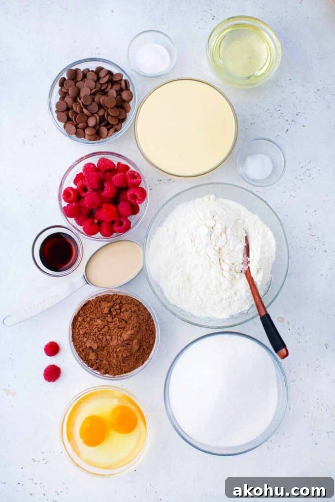 Chocolate Baileys Poke Cake Recipe 4 chocolate baileys poke cake ingredients in bowls on a table