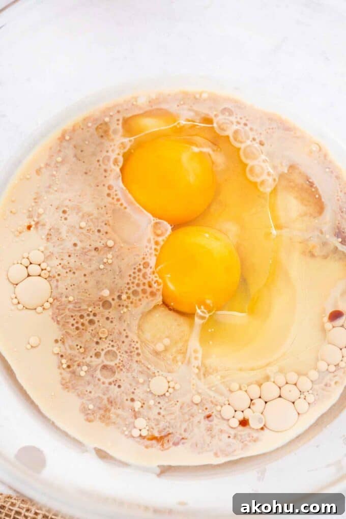 Chocolate Baileys Poke Cake Recipe 7 eggs, oil and Baileys in a bowl
