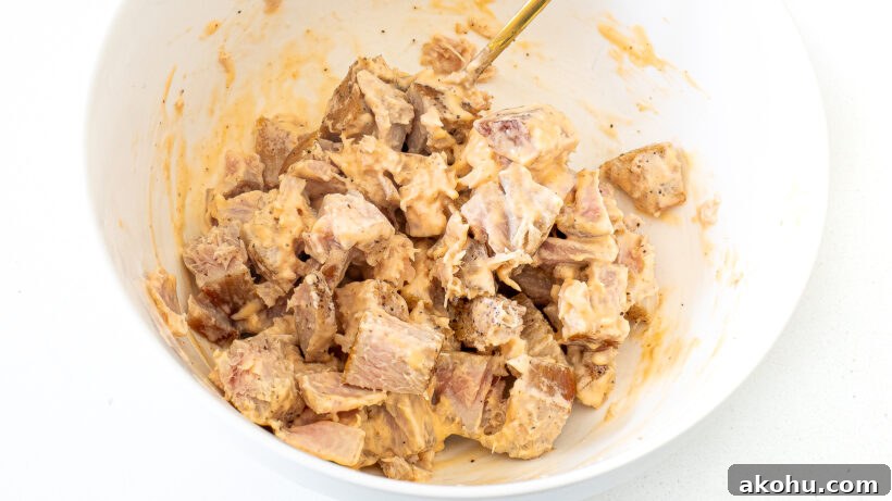 Ahi tuna dressed in spicy mayo in a bowl.