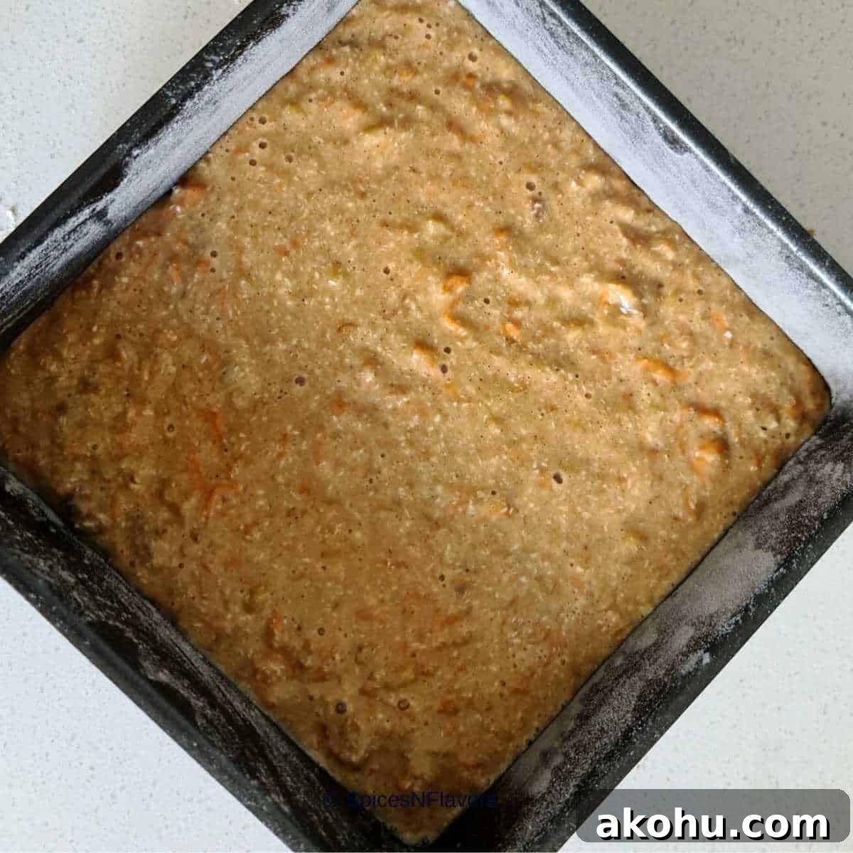 carrot cake batter poured in the prepared pan