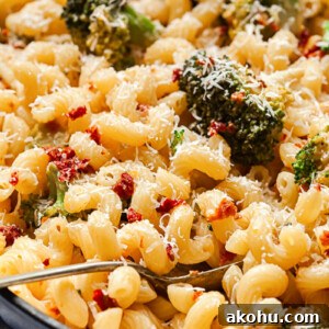 pasta with broccoli and sun-dried tomatoes in a pan