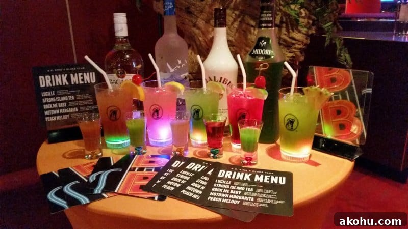 Table with drink menus and HOlland America cocktails in glasses